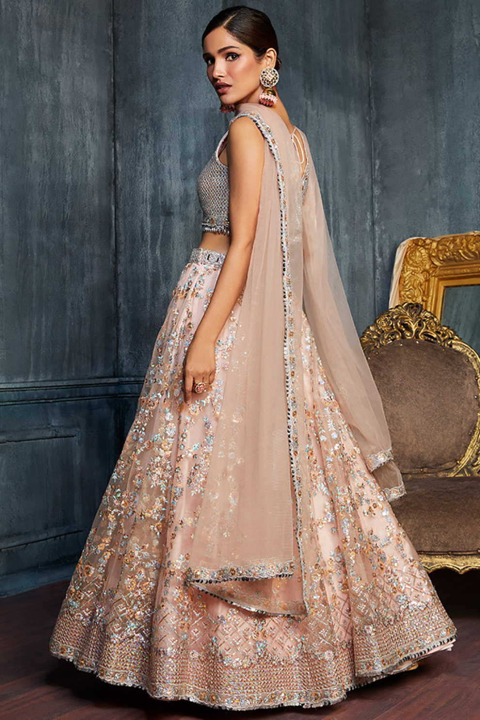 Charming Peach Sequins Net Engagement Wear Lehenga Choli With Dupatta