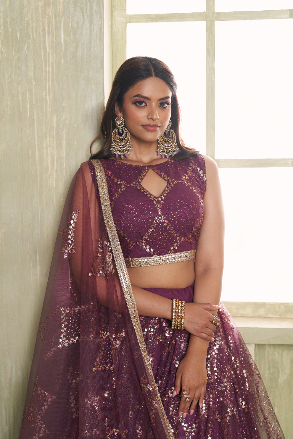 Stylish Wine Embroidered Net Lehenga Choli for Special Occasions