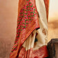 Parchment White Woven Banarasi Patola Silk Saree with Embroidered Blouse