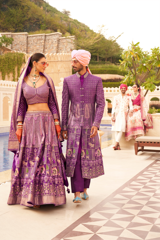 Regal Plum Printed Bridal Lehenga & Floral Print Kurta Set for Couple