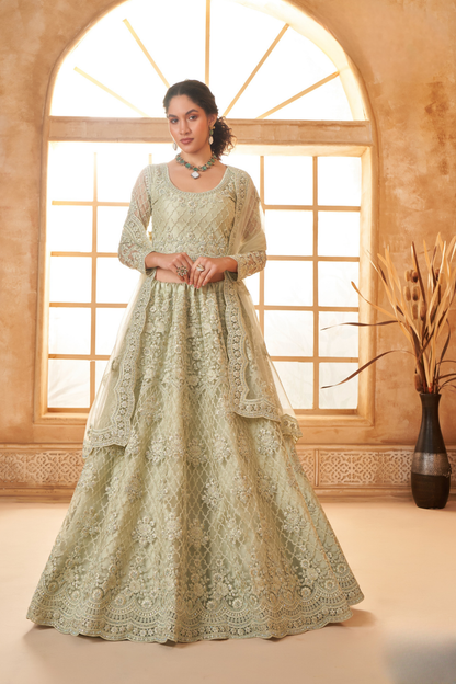 Elegant Pista Green Net Lehenga Choli With Rich Embroidery
