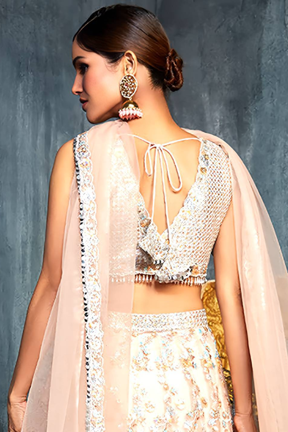 Charming Peach Sequins Net Engagement Wear Lehenga Choli With Dupatta