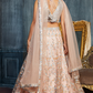 Charming Peach Sequins Net Engagement Wear Lehenga Choli With Dupatta