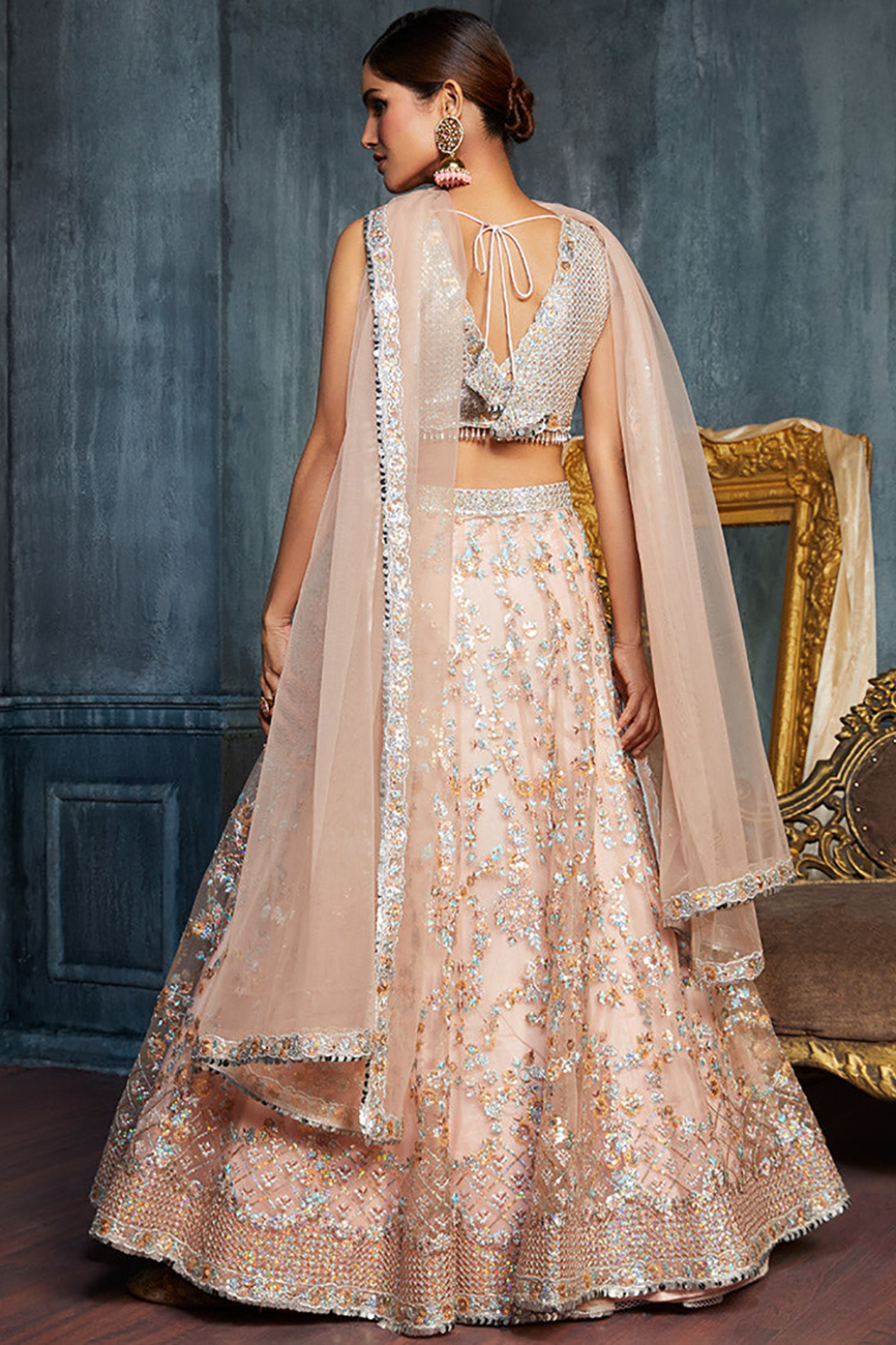Charming Peach Sequins Net Engagement Wear Lehenga Choli With Dupatta
