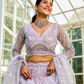 Graceful Net Lehenga Choli Ensemble with Beads