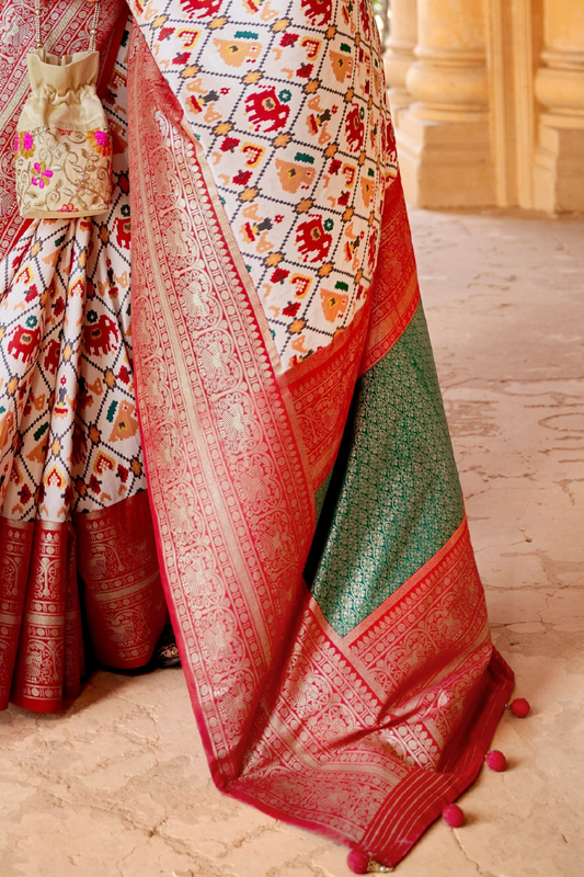 Artisanal Patola Silk Saree with Elegant Tassel Touch