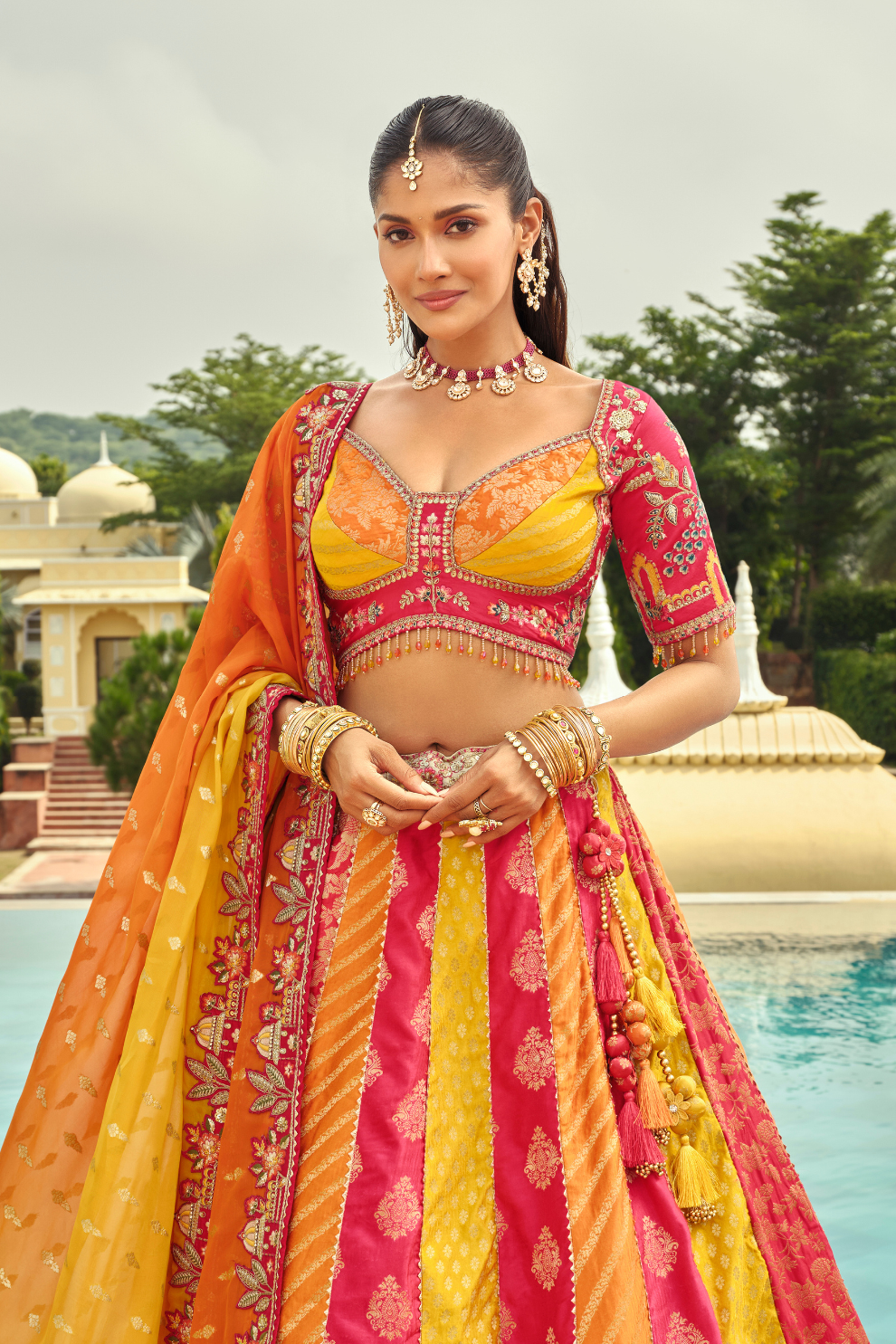 Sunset Orange and Pink Embroidered Silk Bridal Lehenga with Cut-Work Hem