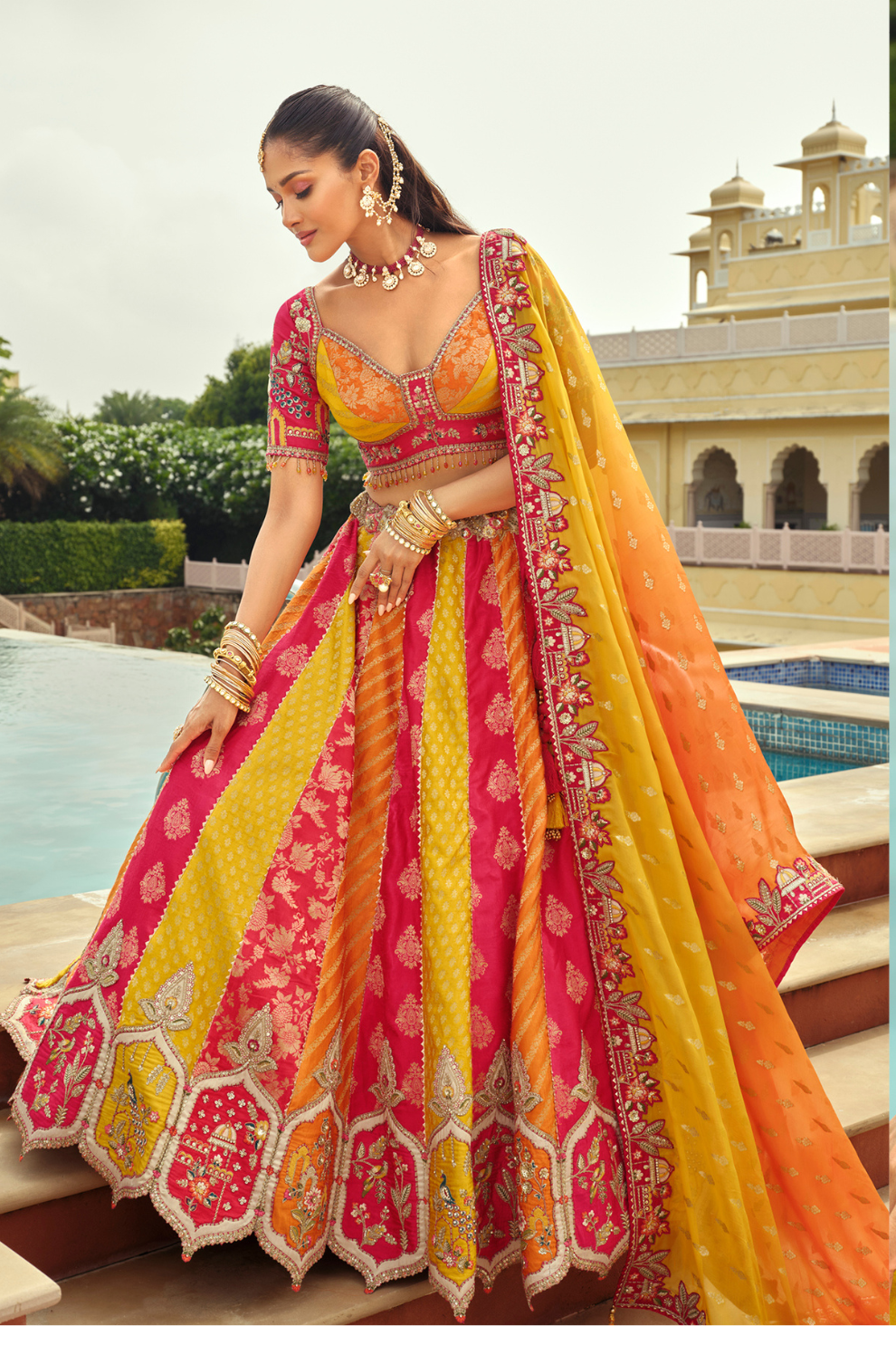 Sunset Orange and Pink Embroidered Silk Bridal Lehenga with Cut-Work Hem