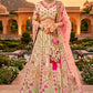 Charming Beige and Pink Embroidered Silk Lehenga Choli with Net Dupatta